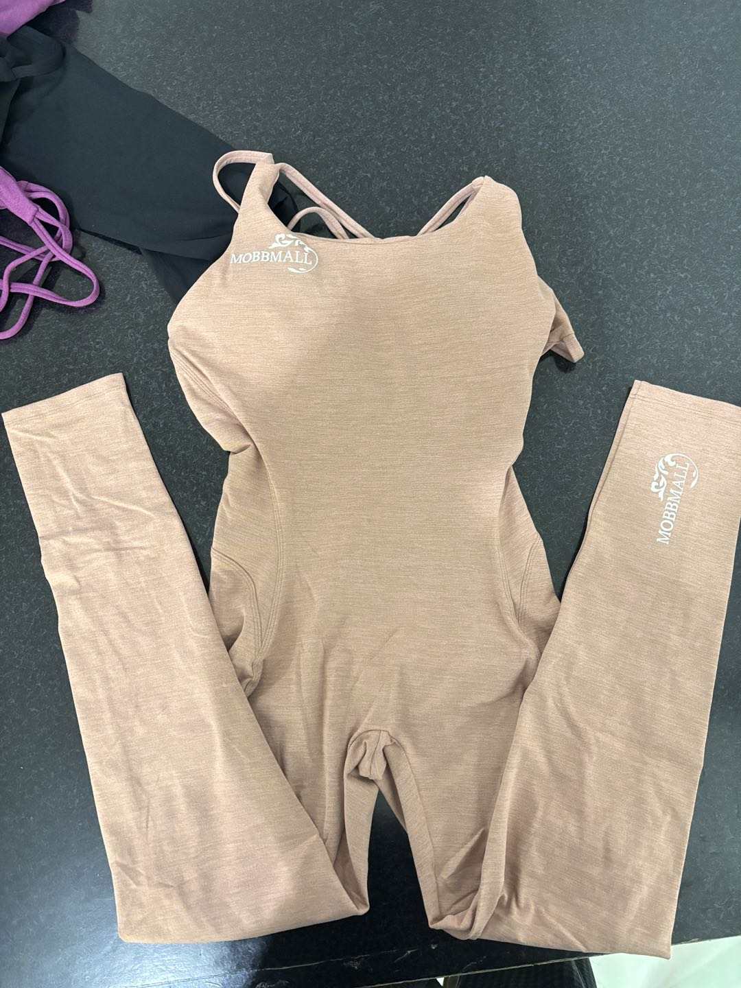 Beige MobbMall's compression one-piece activewear